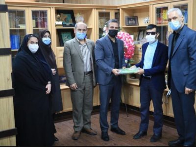 تجلیل سرپرست بهزیستی گیلان از جوان روشندل قرآنی 